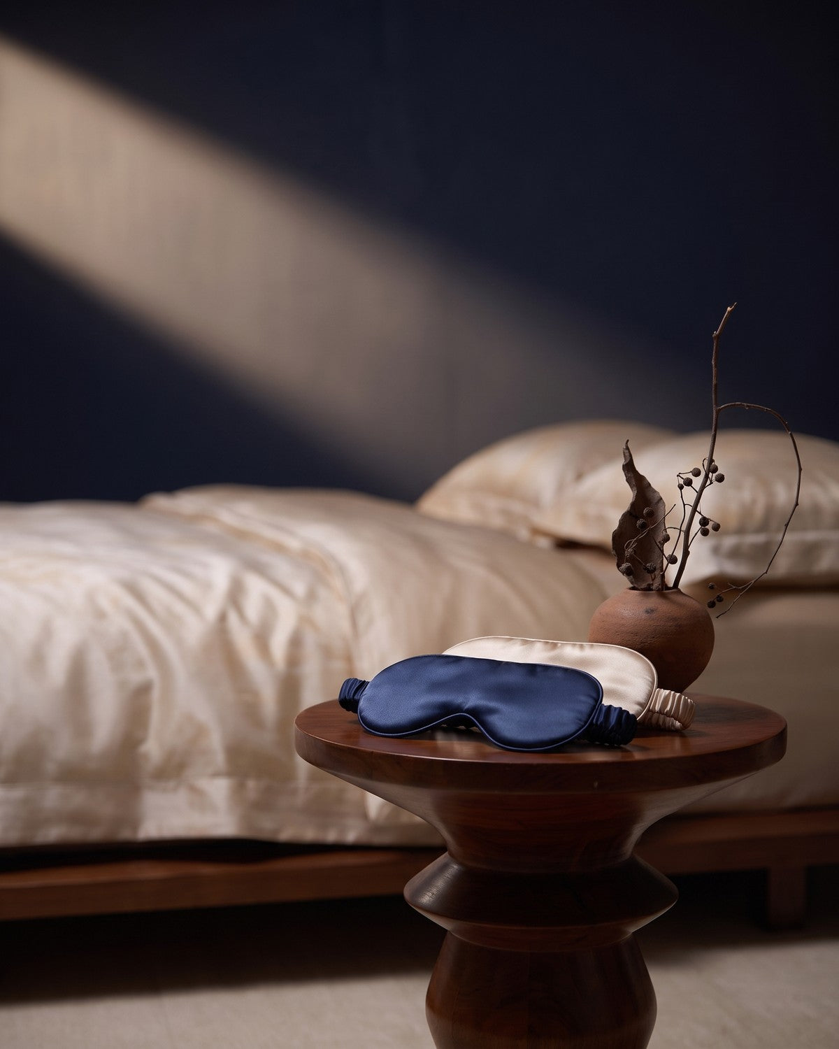 KINT silk sleep masks on a bedside table