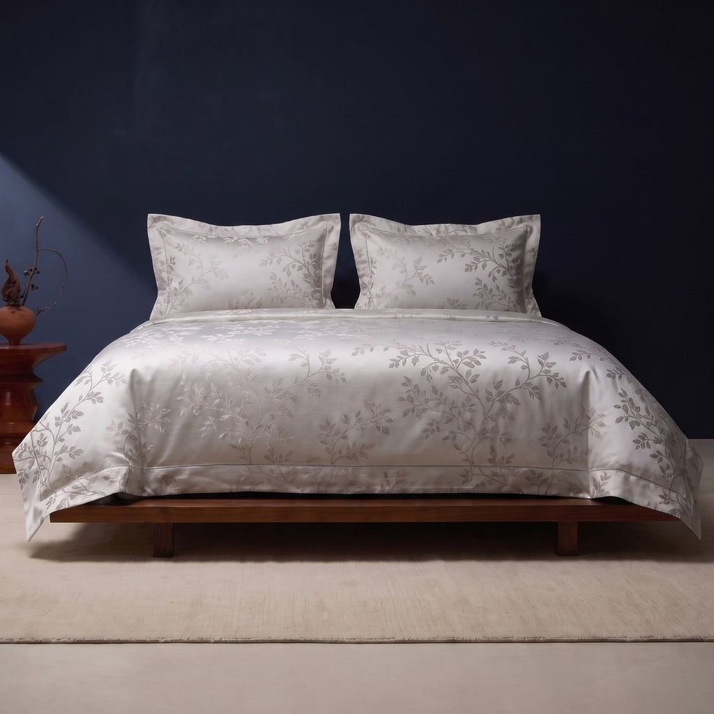 KINT 140s cotton jacquard four-piece bedding set in Forest Mist on a bed in a calm bedroom