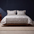 KINT 140s cotton jacquard four-piece bedding set in Forest Mist on a bed in a calm bedroom