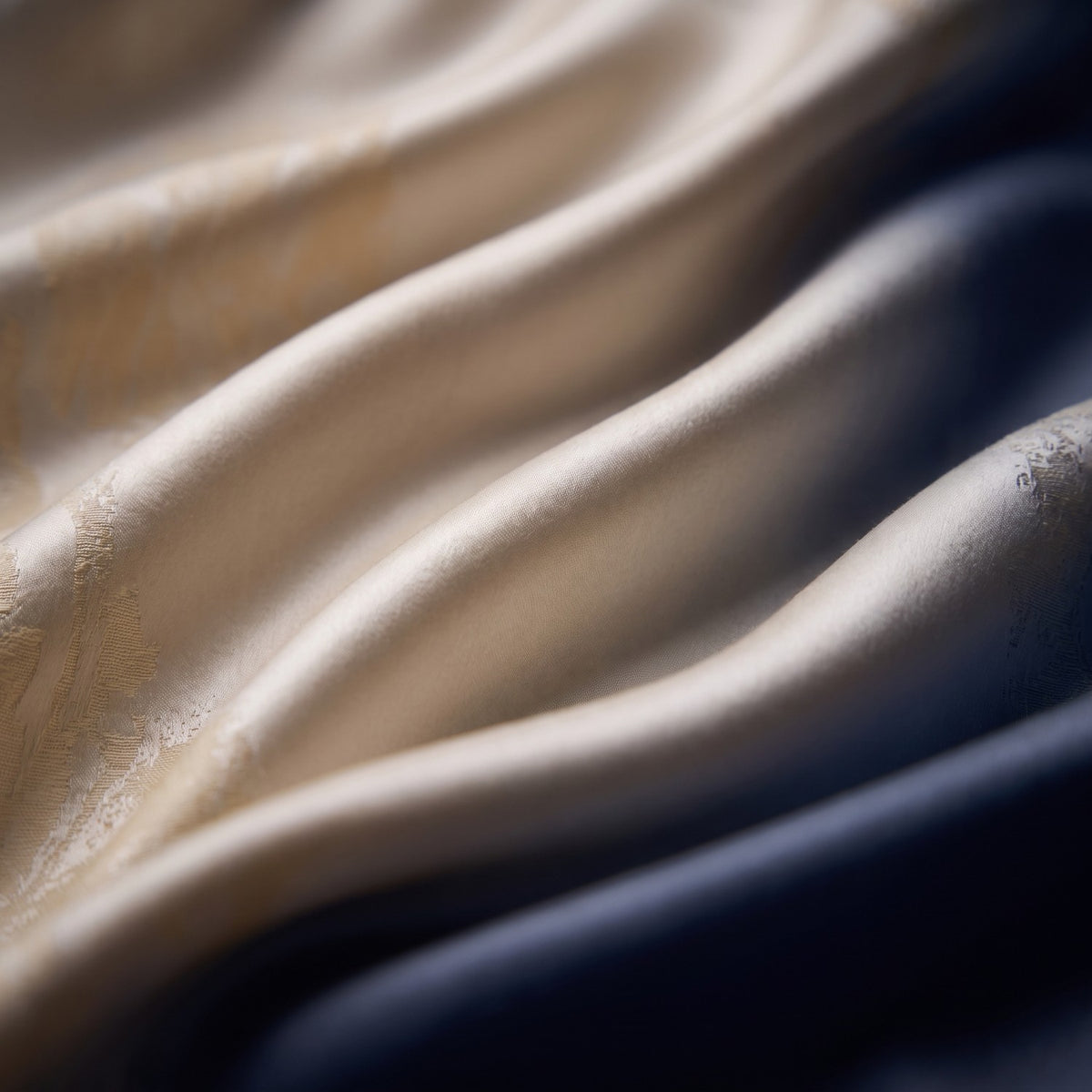 Close-up of the Golden Ivory jacquard weave with its woven foliage pattern