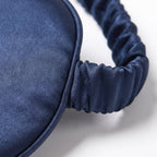 Close-up of the silk weave, piped edge and gathered silk band of the KINT classic sleep mask