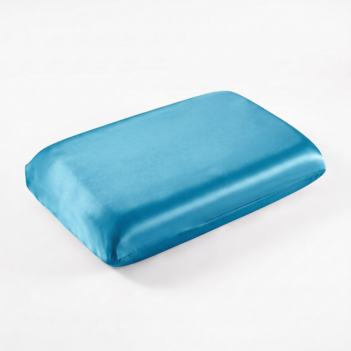 KINT fitted 19 momme mulberry silk pillow cover in Ocean Blue, on a memory foam pillow