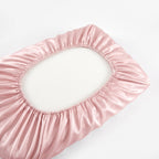 Underside of a pillow showing the elastic edge of the fitted KINT silk cover