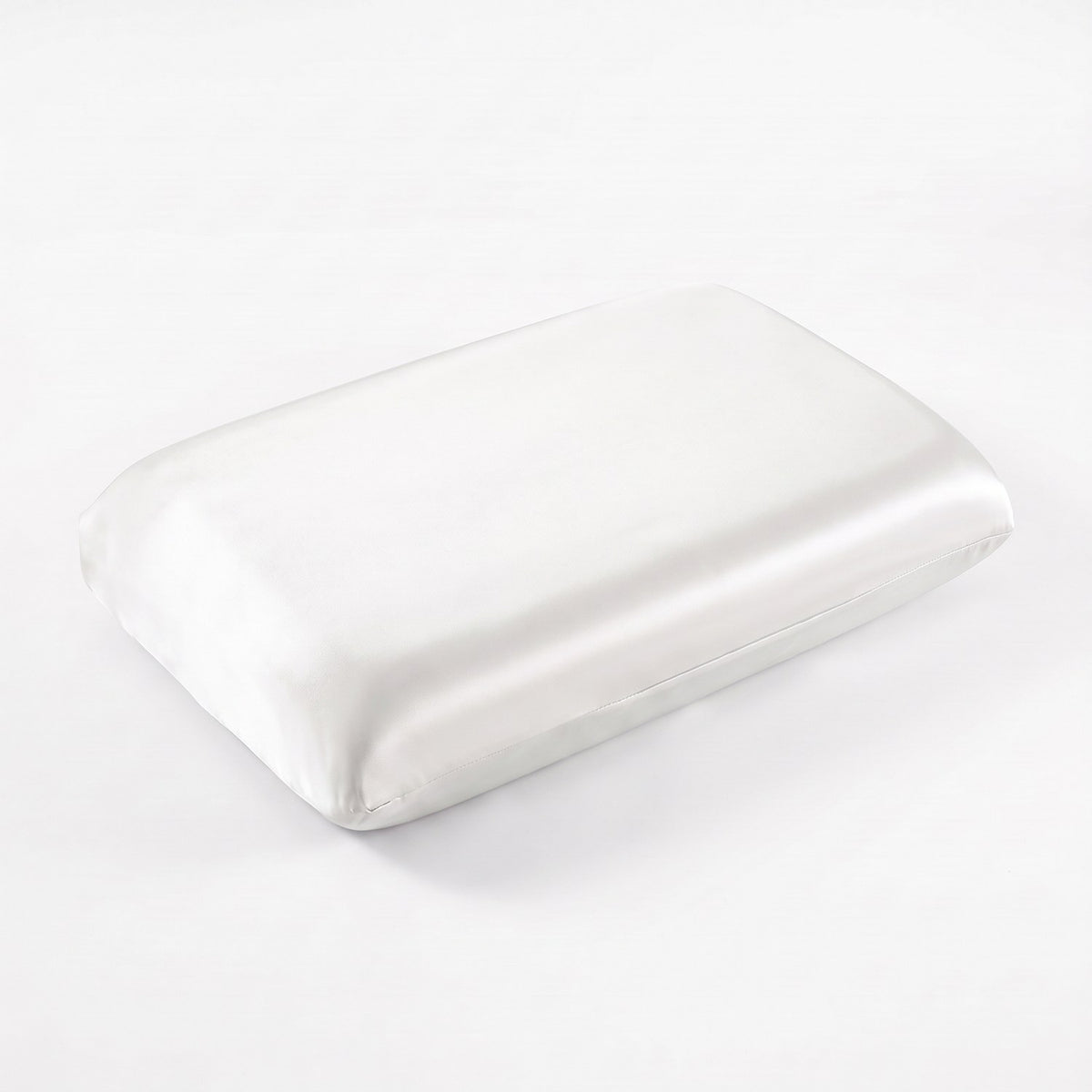 KINT fitted 19 momme mulberry silk pillow cover in White, on a memory foam pillow