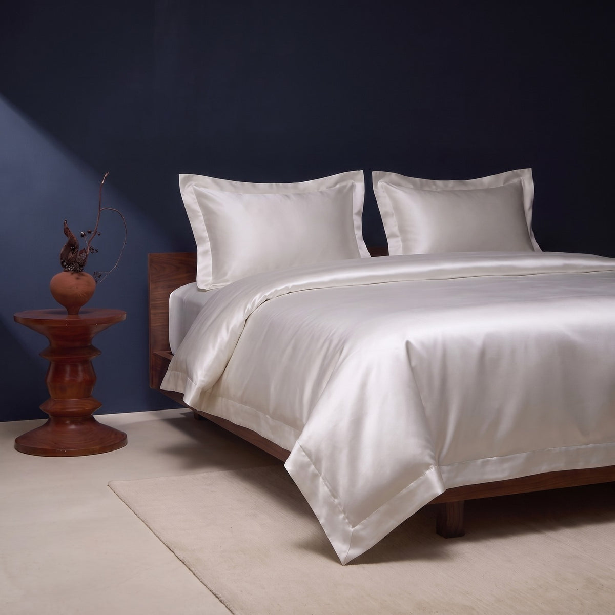 KINT 19 momme mulberry silk four-piece bedding set seen from the side in a bedroom with morning light
