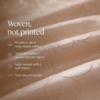 Woven, not printed: mulberry silk and long-staple cotton, jacquard pattern woven into the fabric, satin weave, satin bound border
