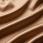 Close-up of light gold silk and cotton satin in soft folds