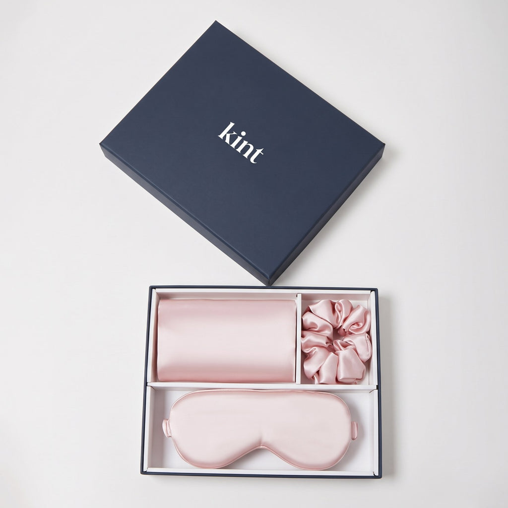 KINT 22 momme mulberry silk gift set (pillowcase, sleep mask and scrunchie) in Blush Pink, in a navy KINT gift box
