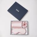 KINT 22 momme mulberry silk gift set (pillowcase, sleep mask and scrunchie) in Blush Pink, in a navy KINT gift box