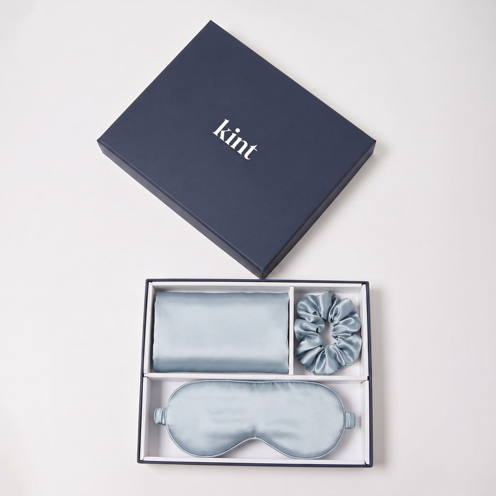 KINT 22 momme mulberry silk gift set (pillowcase, sleep mask and scrunchie) in Mist Blue, in a navy KINT gift box