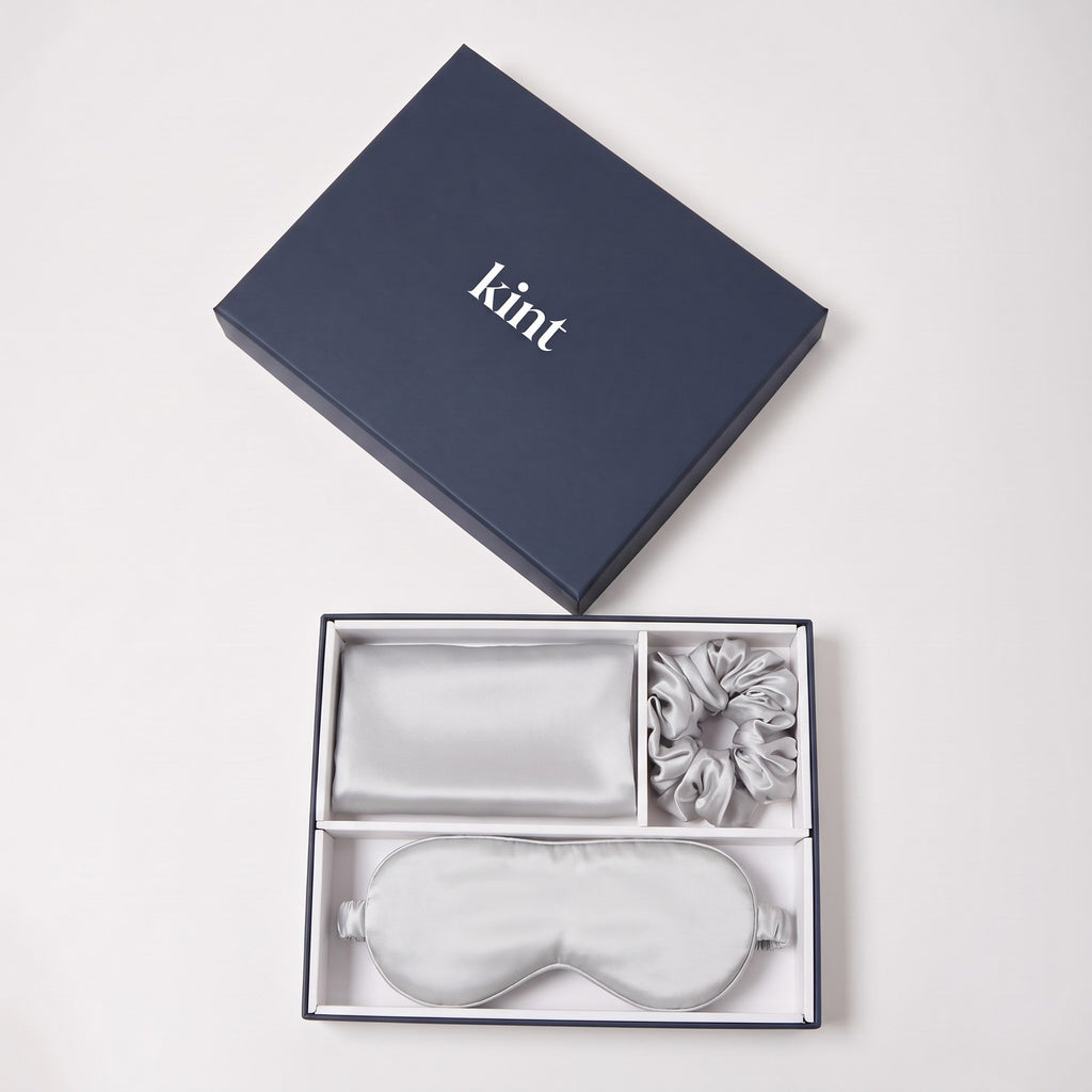 KINT 22 momme mulberry silk gift set (pillowcase, sleep mask and scrunchie) in Silver Grey, in a navy KINT gift box
