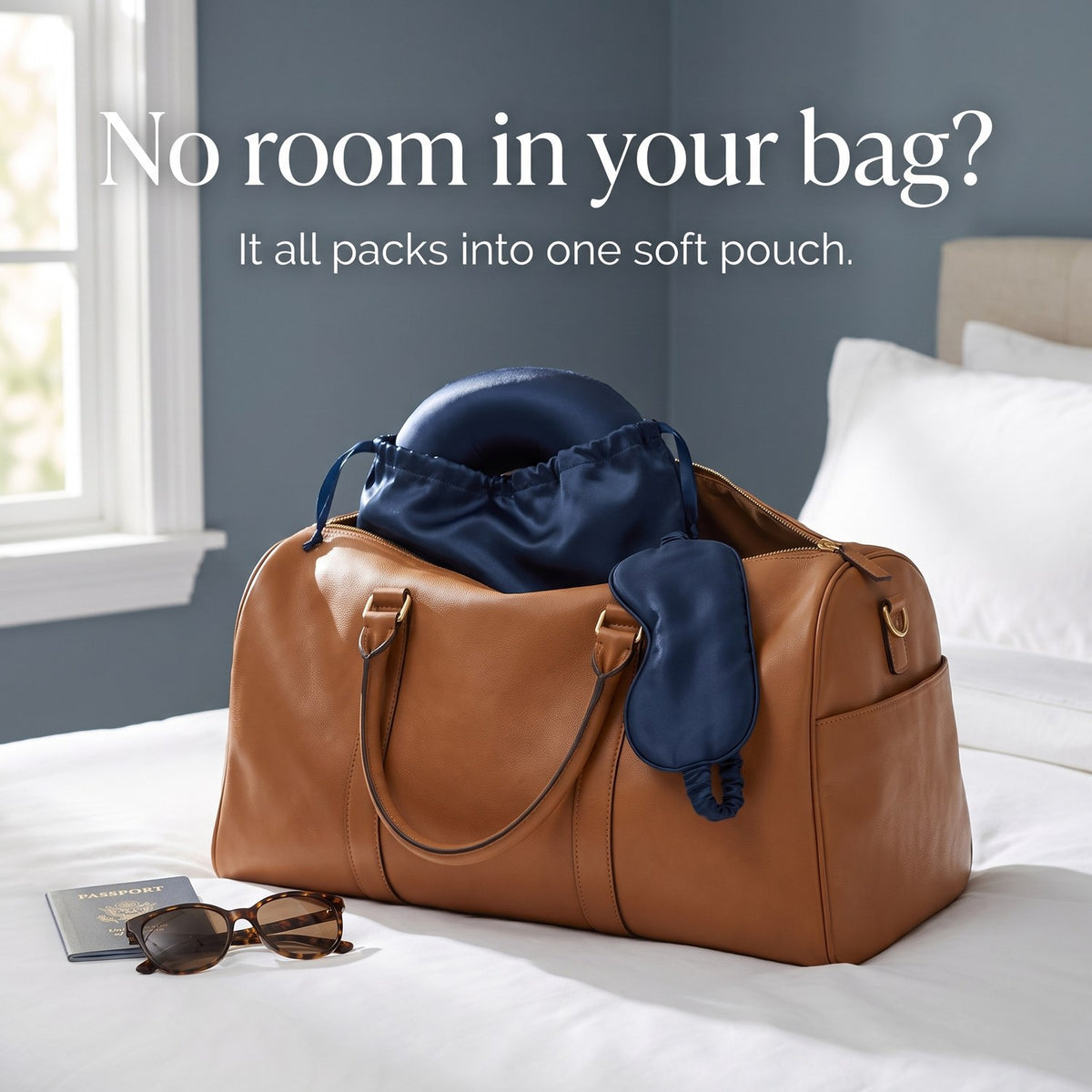 The KINT silk travel set packed in its pouch inside a leather weekend bag