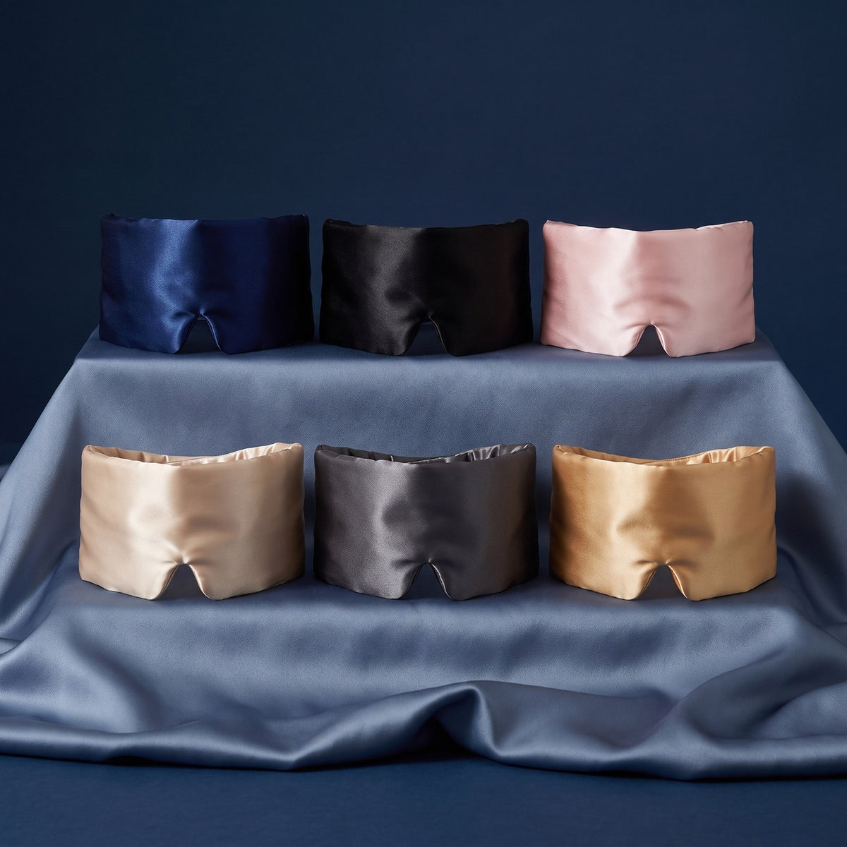 KINT silk wrap sleep mask in six colors on slate blue silk